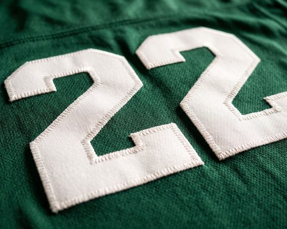 Stitched number on a green jersey